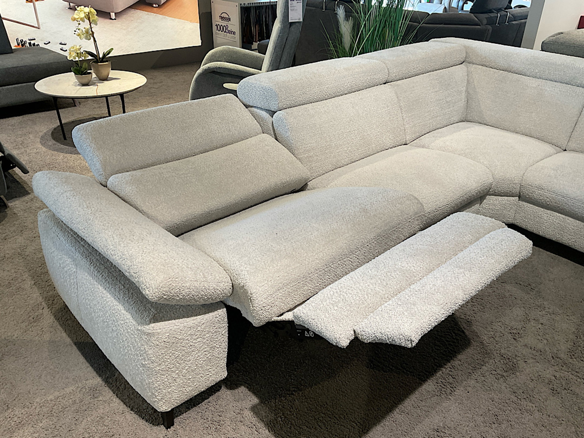 Modulmaster Ecksofa inkl. vielen Funktionen und Hocker in Boucle Stoff