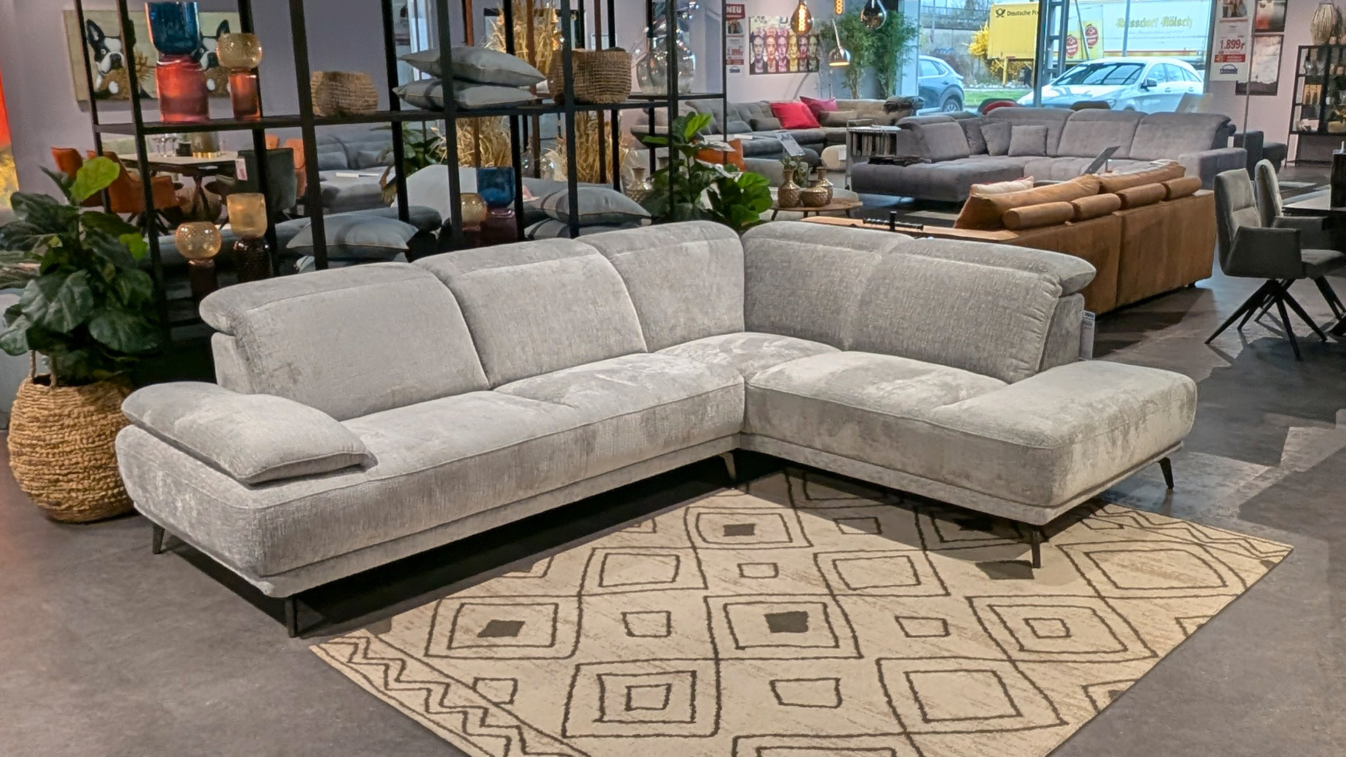 Cuoio Ecksofa inkl. Kopfteilverstellung in Stoff