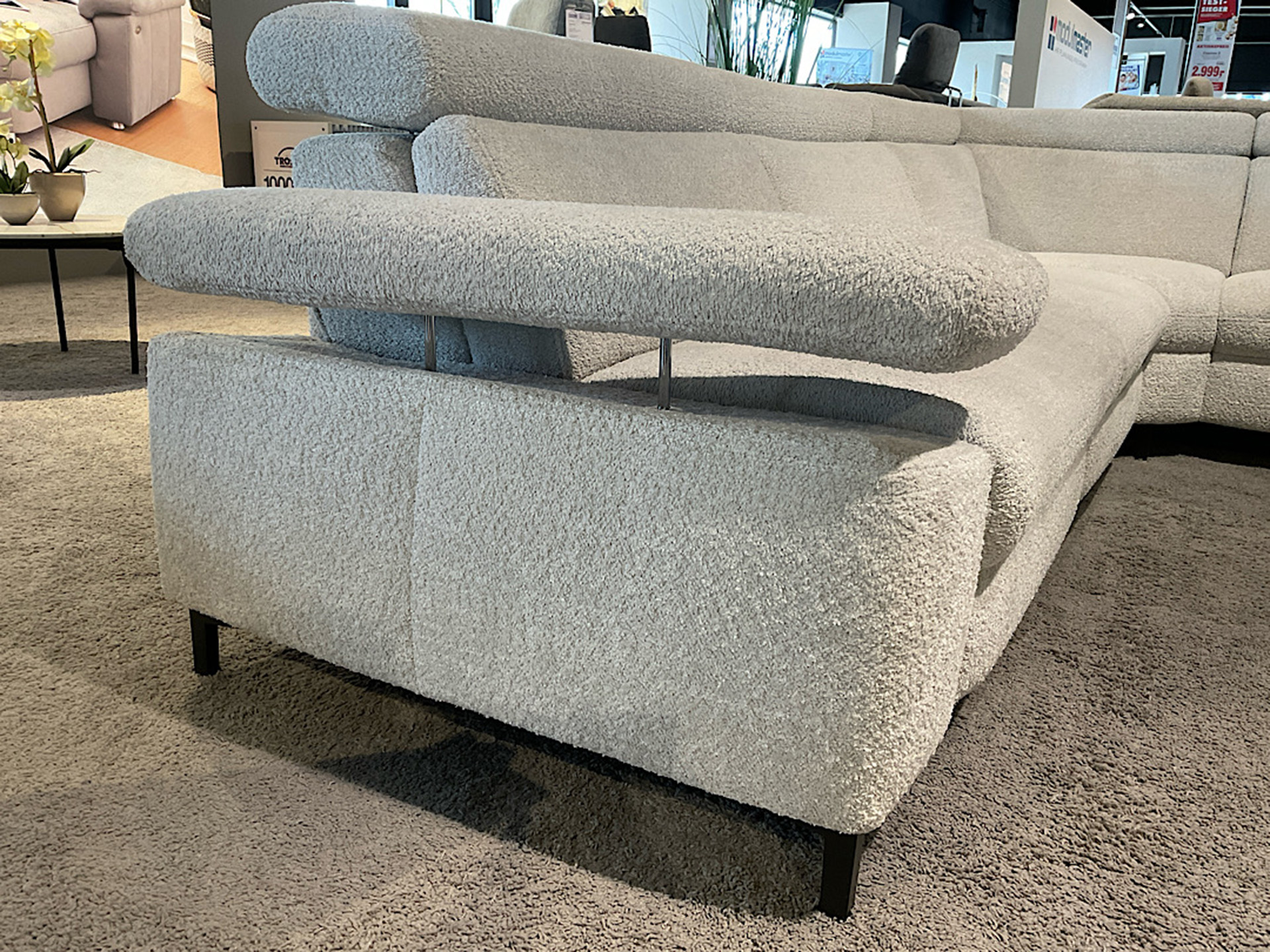 Modulmaster Ecksofa inkl. vielen Funktionen und Hocker in Boucle Stoff